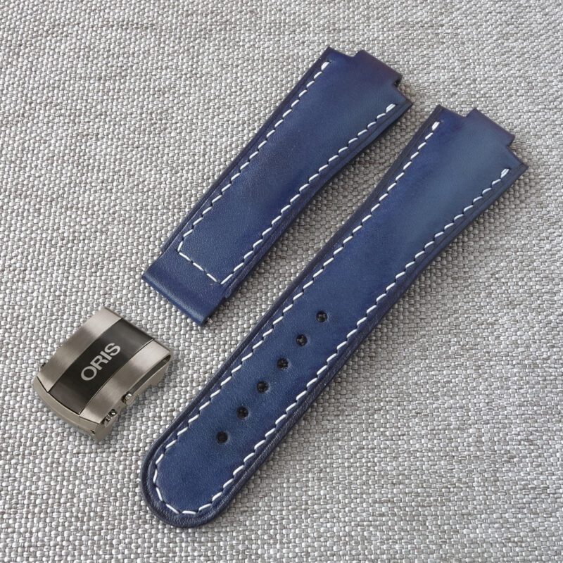 Blue leather watch strap, fits the original ORIS Aquis deployment clasp. 100% handmade, replacement watchband. Made of the high quality genuine leather. It is possible to produce a strap of any color and size, as desired by the customer. For ORIS Aquis watches: 39.5mm/ 41.5mm Calibre 400/ 43.5mm/ 43mm/ 45.5mm/ 46mm, Divers, Aquis Date, TT1, F1, Other Oris Models.