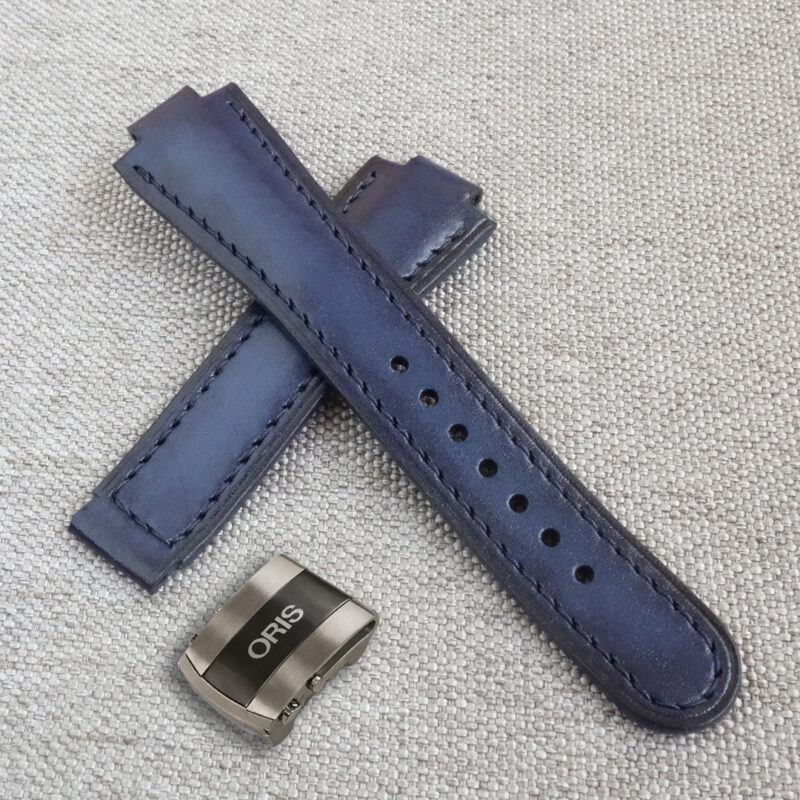 Dark blue leather watch strap, fits the original ORIS Aquis deployment clasp. 100% handmade, replacement watchband. Made of the high quality genuine leather. It is possible to produce a strap of any color and size, as desired by the customer. For ORIS Aquis watches: 39.5mm/ 41.5mm Calibre 400/ 43.5mm/ 43mm/ 45.5mm/ 46mm, Divers, Aquis Date, TT1, F1, Other Oris Models.