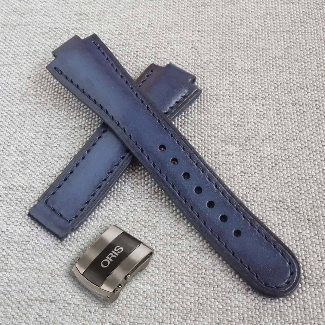 Dark blue leather watch strap, fits the original ORIS Aquis deployment clasp. 100% handmade, replacement watchband. Made of the high quality genuine leather. It is possible to produce a strap of any color and size, as desired by the customer. For ORIS Aquis watches: 39.5mm/ 41.5mm Calibre 400/ 43.5mm/ 43mm/ 45.5mm/ 46mm, Divers, Aquis Date, TT1, F1, Other Oris Models.